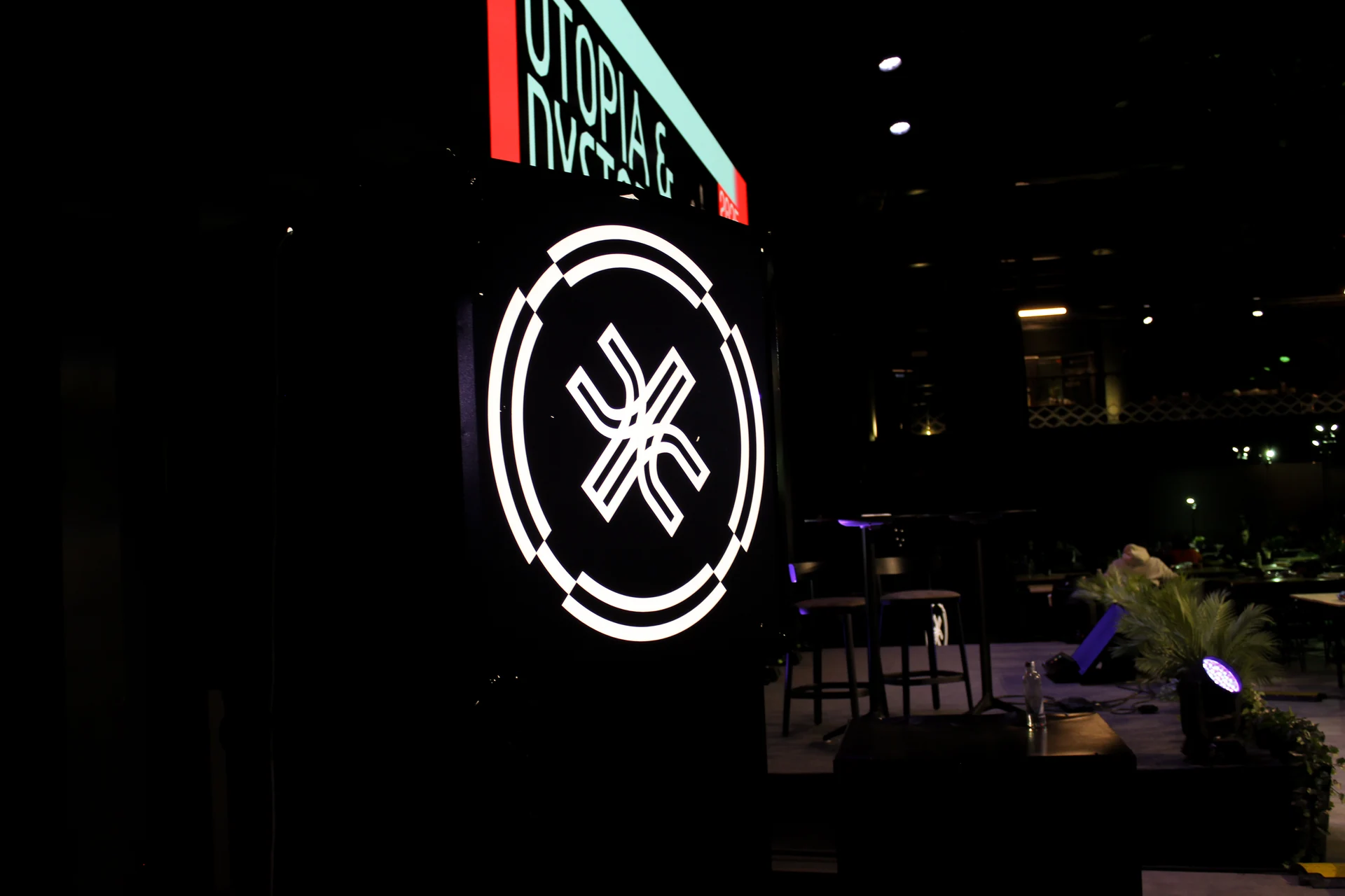 Illuminated Junction emblem beside the stage at Junction 2025